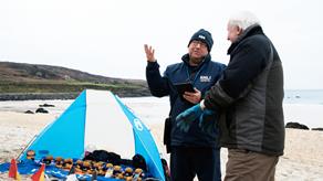 F2F fundraiser David Lilley talking to members of the public on Porthmeor beach, St Ives