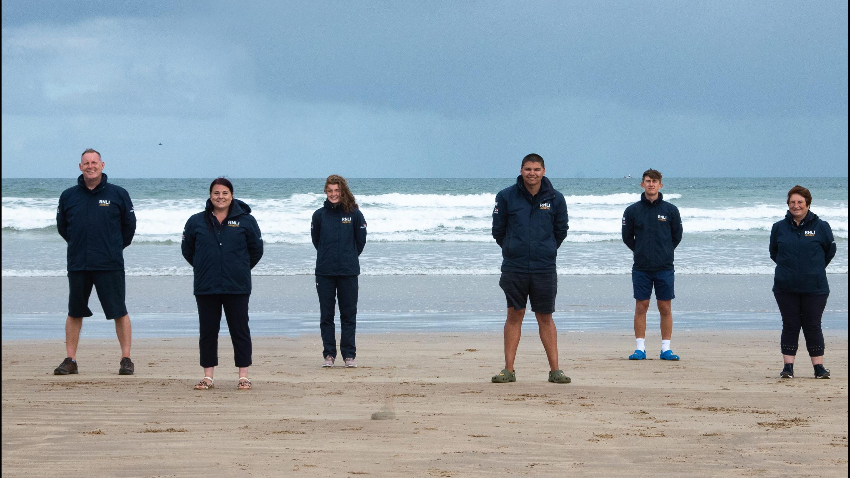 Group shot of RNLI Face to Face fundraisers at Portrush beach, Northern Ireland.